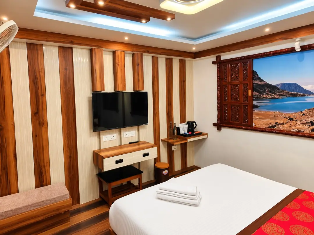 Executive Room with striped timber wall, wall-mounted television, desk and tea tray